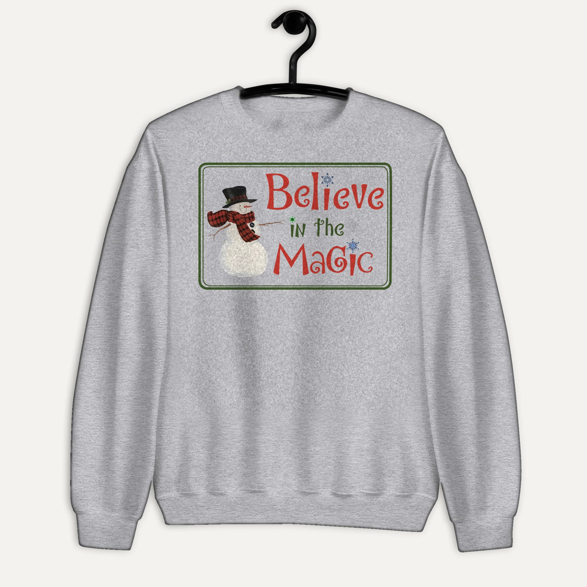 Believe In The Magic Unisex Long Sleeve Sweatshirt in Sport Grey, on hanger