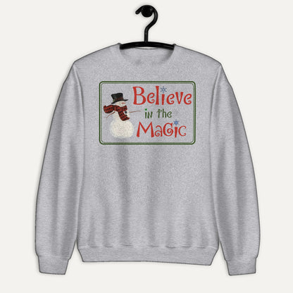 Believe In The Magic Unisex Long Sleeve Sweatshirt in Sport Grey, on hanger