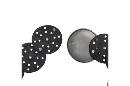 Detail of the hook closure and silver-tone rivets on the black concho belt