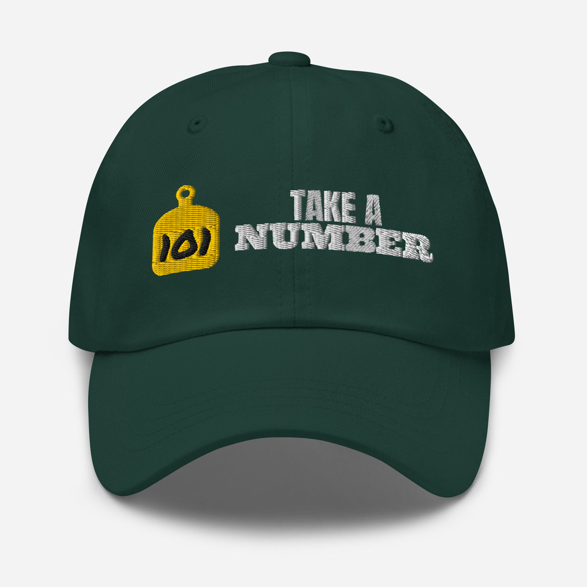 Take A Number Cow Tag Embroidered Dad Hat in Spruce, front view