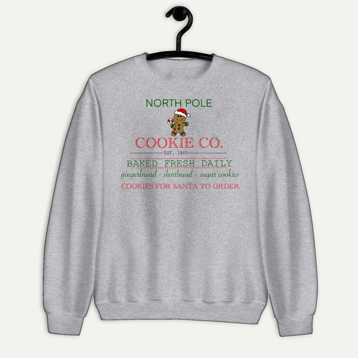 North Pole Cookie Co. Unisex Long Sleeve Sweatshirt in Sport Grey, on hanger