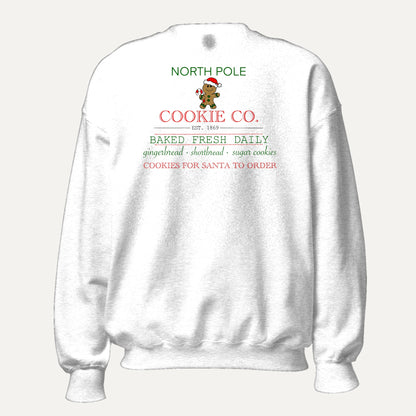 North Pole Cookie Co. Unisex Long Sleeve Sweatshirt in White, front view