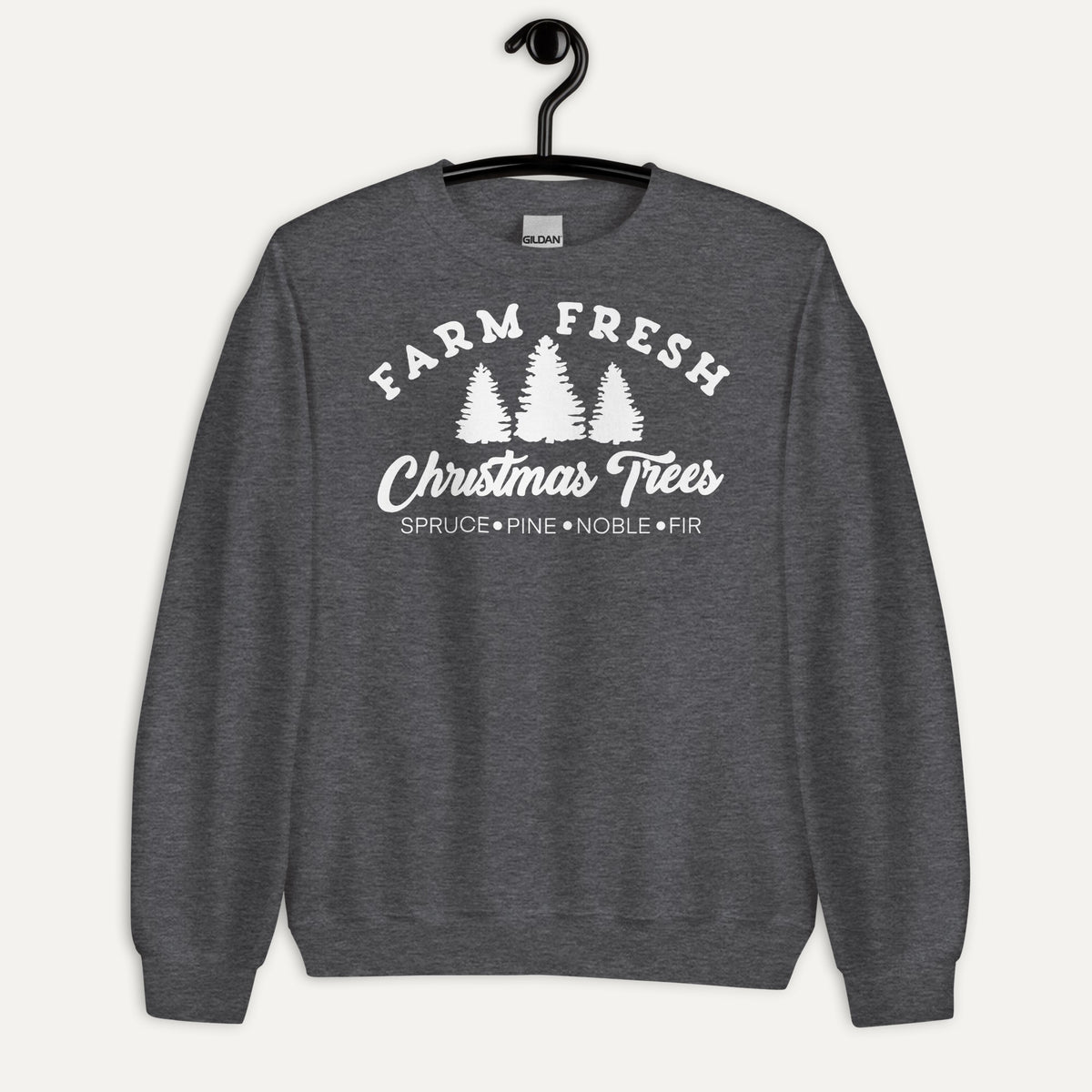 Farm Fresh Christmas Trees Unisex Long Sleeve Sweatshirt in Dark Heather, on hanger