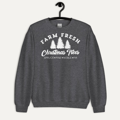Farm Fresh Christmas Trees Unisex Long Sleeve Sweatshirt in Dark Heather, on hanger