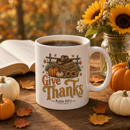 Give Thanks Psalm 107:1 mug on a rustic table in a cozy fall setting