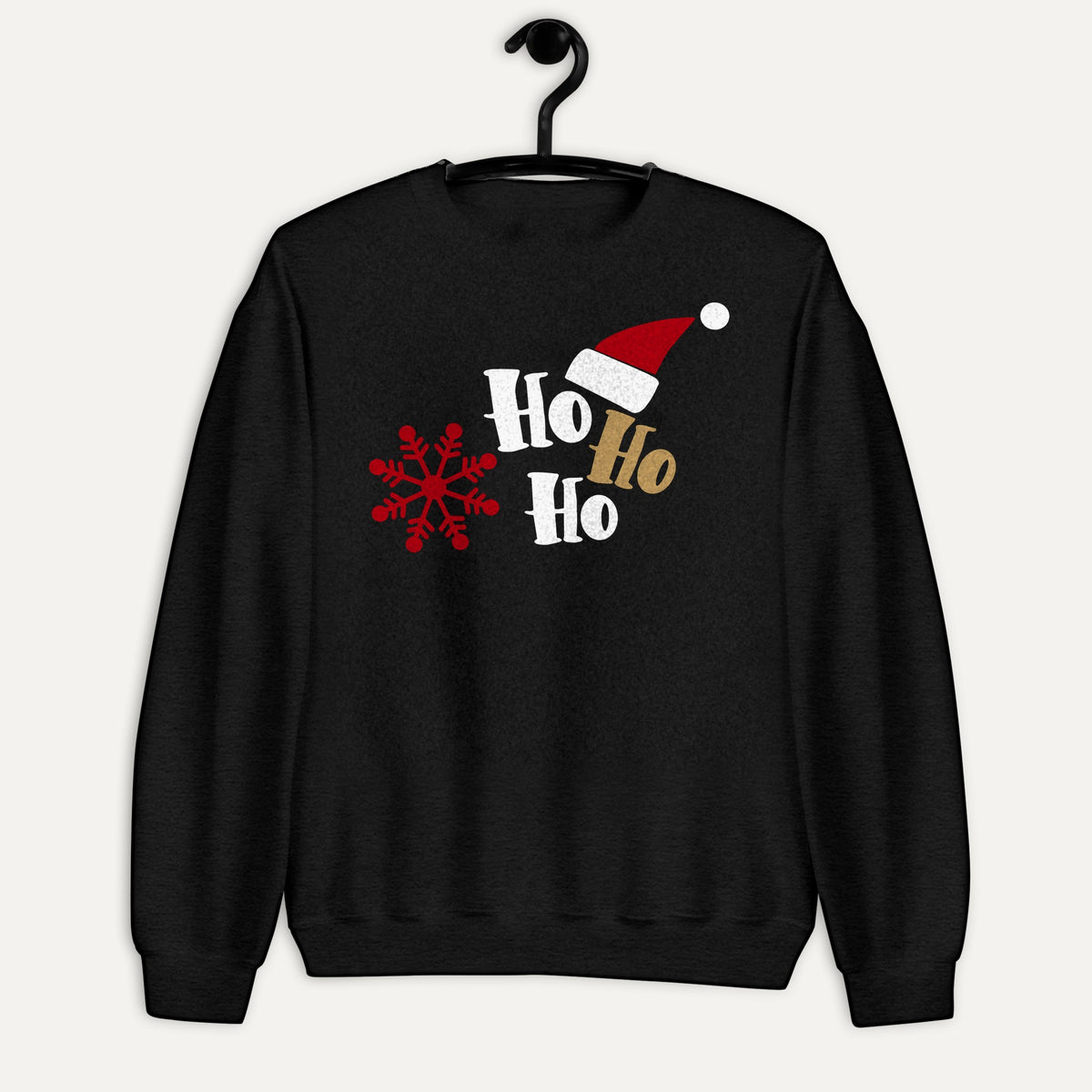 Ho Ho Ho Santa Hat And Snowflake Unisex Long Sleeve Sweatshirt in Black, on hanger