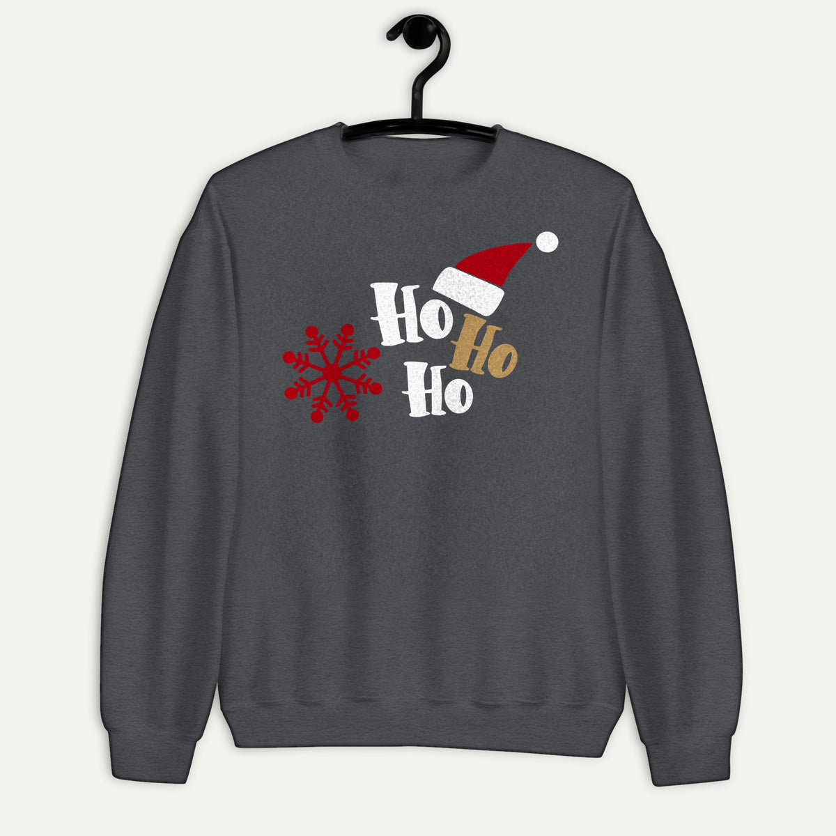 Ho Ho Ho Santa Hat And Snowflake Unisex Long Sleeve Sweatshirt in Dark Heather, on hanger