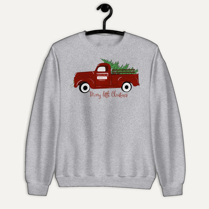 Merry Little Christmas Red Truck Unisex Long Sleeve Sweatshirt in Sport Grey, on hanger