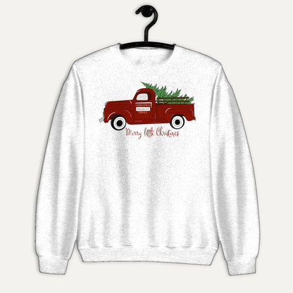 Merry Little Christmas Red Truck Unisex Long Sleeve Sweatshirt in White, on hanger