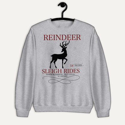 Reindeer Sleigh Rides Unisex Long Sleeve Sweatshirt in Sport Grey, on hanger