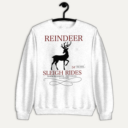Reindeer Sleigh Rides Unisex Long Sleeve Sweatshirt in White, on hanger