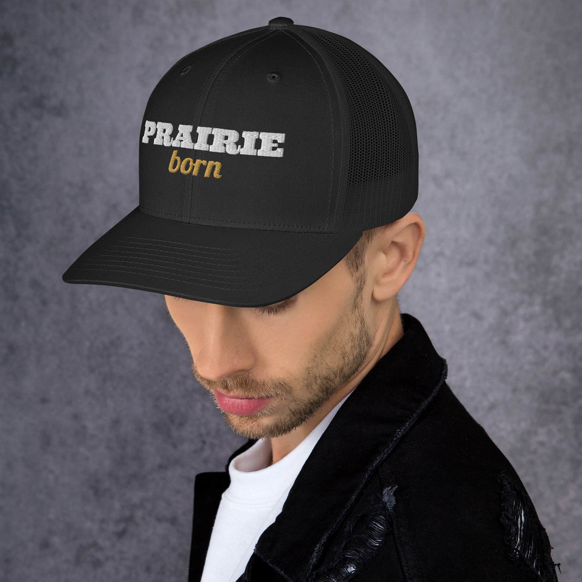 Prairie Born Embroidered Trucker Hat in Black, left front view