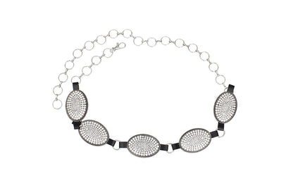 Silver-tone chain belt with rhinestone oval conchos laid flat