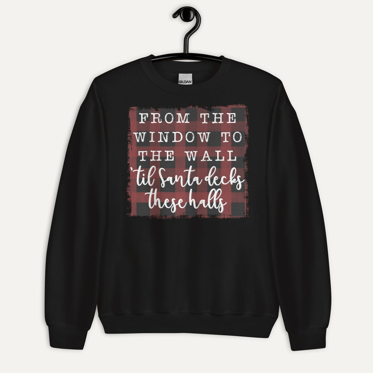 Santa Decks These Halls Unisex Long Sleeve Sweatshirt in Black, on hanger