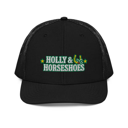 Holly & Horseshoes Embroidered Trucker Hat in Black, front view