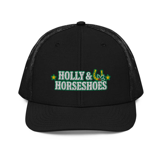 Holly & Horseshoes Embroidered Trucker Hat in Black, front view