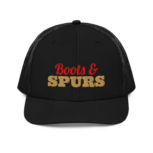 Boots & Spurs Embroidered Trucker Hat in Black, front view