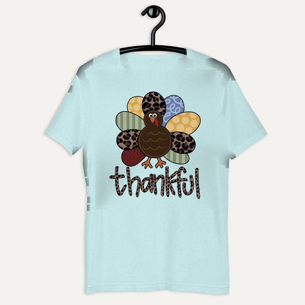 Thankful Pattern Turkey Short Sleeve Tee in Heather Prism Ice Blue, on hanger